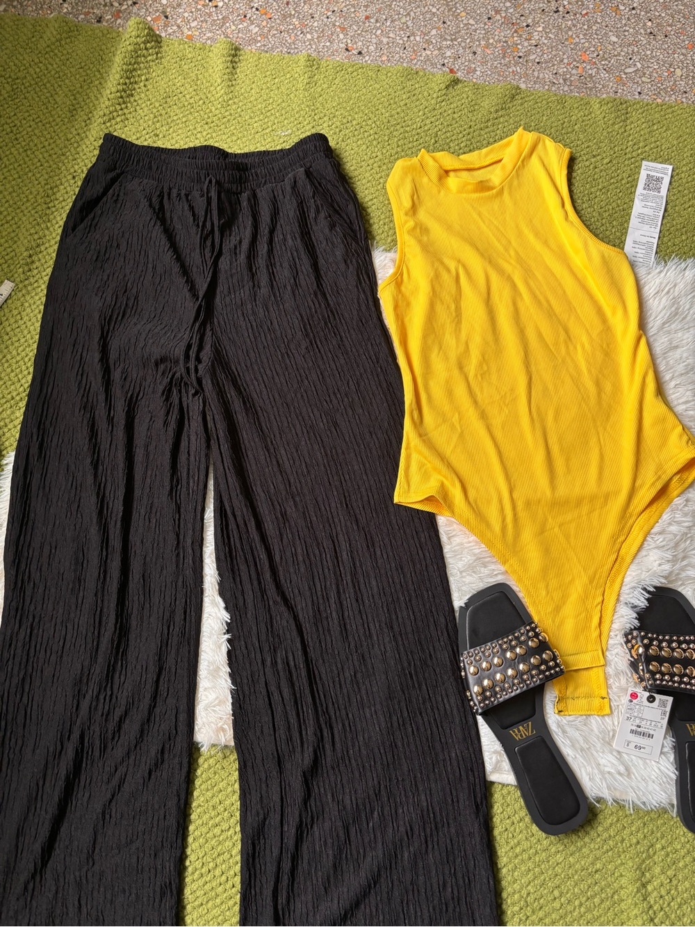 Black Crinkled Wide-Leg Pants and yellow bodysuit and slides sandals